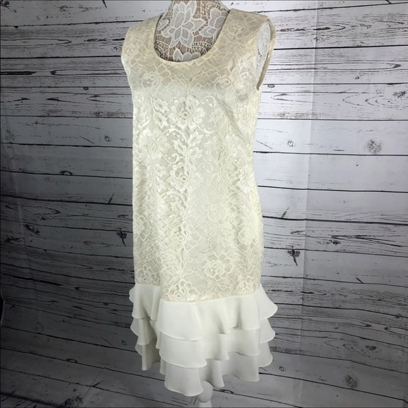 Leslie Fay sleeveless 
Beautiful lace dress with layered ruffles on the end. - Picture 10 of 12